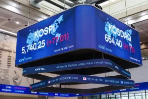 Electronic board displaying KOSPI and KOSDAQ index figures in Seoul