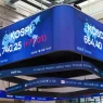 Electronic board displaying KOSPI and KOSDAQ index figures in Seoul