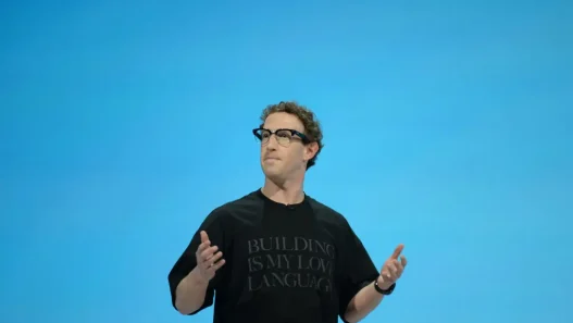 Mark Zuckerberg speaking on stage gesturing with both hands